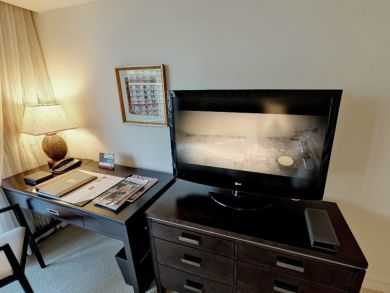 Bedroom with flat screen TV & des