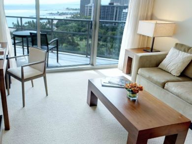 Ocean view balcony with table set