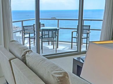 Ocean front balcony with table set