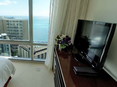 Bedroom with flat screen & ocean view