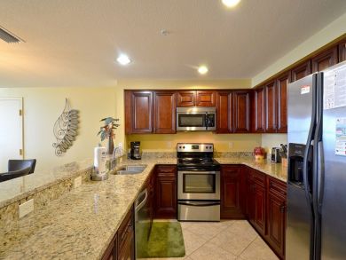 Kitchen with granite counter tops & stainless steel appliances