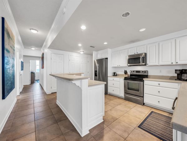 Spacious 5-Bedroom Beachfront Condo with Gulf Views and Luxury Amenities