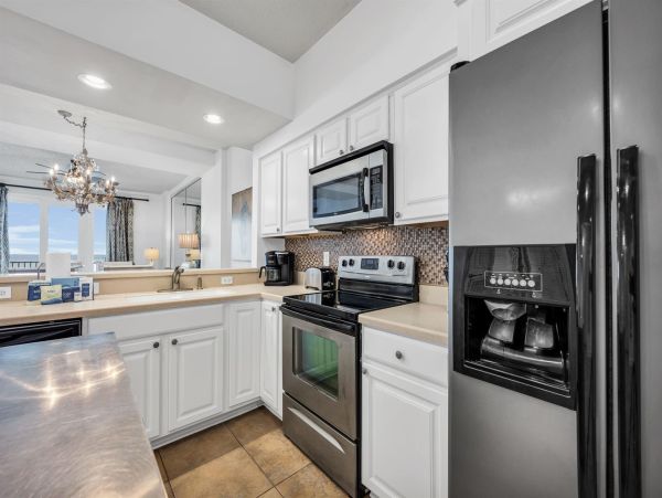 Spacious 5-Bedroom Beachfront Condo with Gulf Views and Luxury Amenities