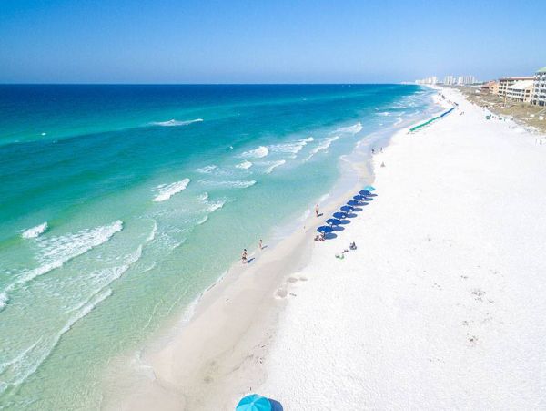 Spacious 5-Bedroom Beachfront Condo with Gulf Views and Luxury Amenities