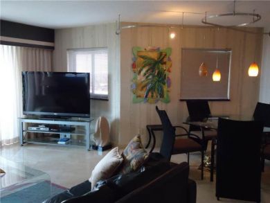 Open plan living space with flat screen TV