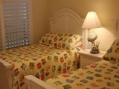 Sample guest bedroom with two double beds