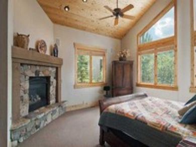 Master bedroom with king bed & fireplace