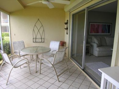 Screened porch with table set