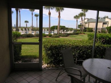 Screened porch with pool view