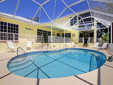 Canal Front Home with Caged Pool in Sanibel, Walk to Beach