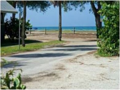 Steps to sandy beach from property