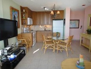 Open plan living space with flat screen TV