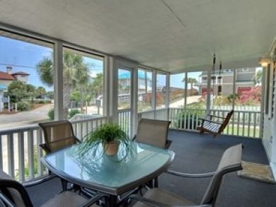Screened porch with outdoor furniture