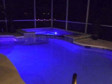 Pool & hot tub view at night