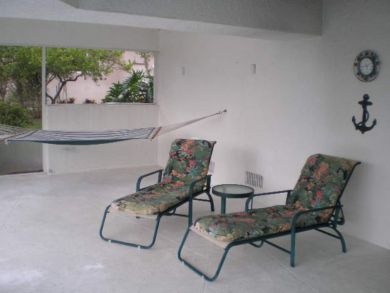 Hammock & sun loungers on porch
