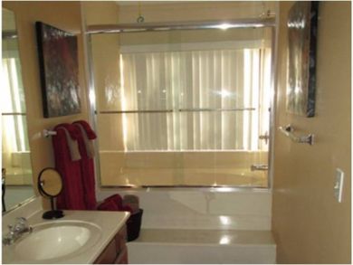 Bathroom with shower in tub Bathroom with shower in tub