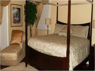 Master bedroom with a king size bed Master bedroom with a king size bed