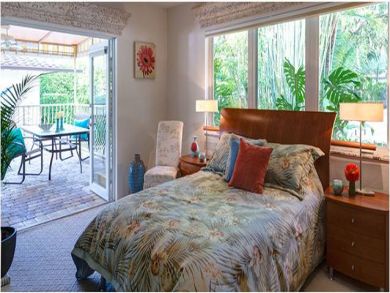 A full size bed in bedroom 2