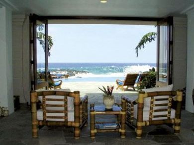 Dramatic surf, lava coast rock & sandy beach view from porch Dramatic surf, lava coast rock & sandy beach view from porch