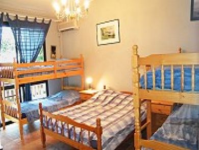 Bedroom 5 with double bed & two sets of bunk beds