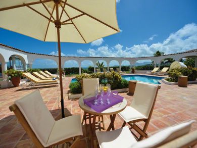 Table set with umbrella by the pool