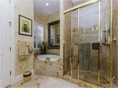 Master bathroom with separate tub and shower