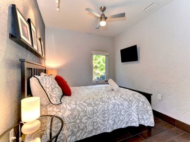 Bedroom with Wall Mounted TV