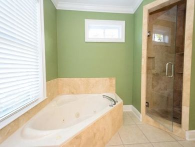Bathroom with tub & walk-in shower Bathroom with tub & walk-in shower