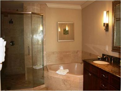 Master bathroom with tub and shower
