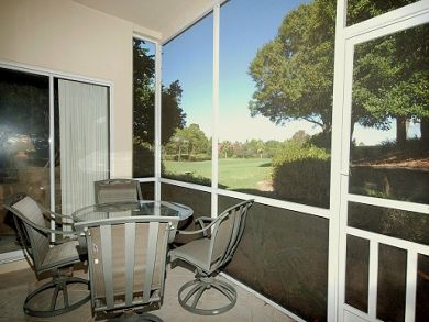 Screened porch with table set