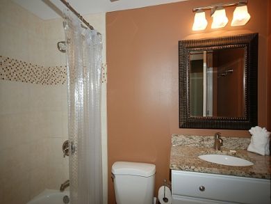 Bathroom with shower in tub Bathroom with shower in tub