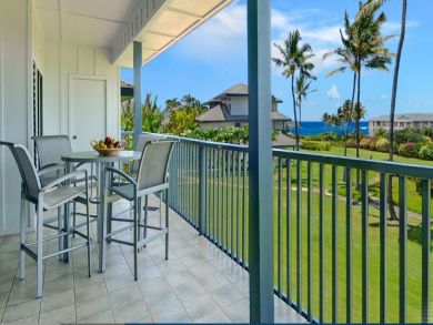Ocean view balcony with table set