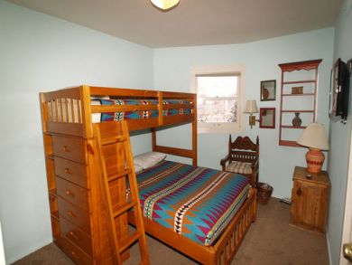 Guest bedroom with one set of bunk beds Guest bedroom with one set of bunk beds