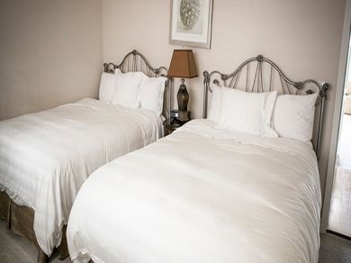 Two queen beds in guest bedroom Two queen beds in guest bedroom