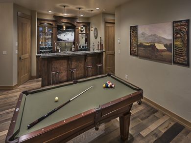 Sports bar/den with billiard table