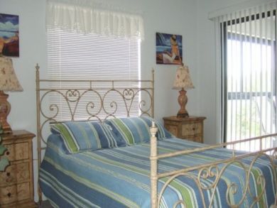 Queen bed in guest bedroom