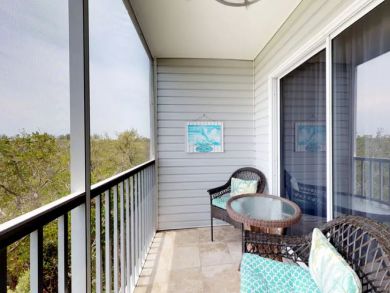 Screened balcony with table set