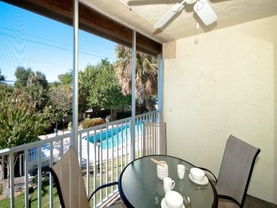 Balcony with Outdoor Furniture and Pool View