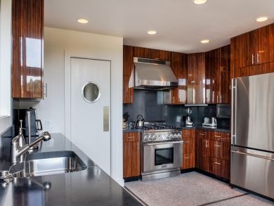 Kitchen with Black Granite Counters & Stainless Appliances