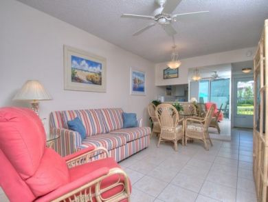 Open Living room with Tiled Floors and walk out to Patio