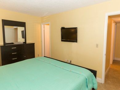 Wall Mounted TV in Bedroom