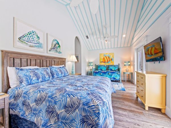 2nd Tri level- Master bedroom with king bed and twin trundle bed with two French doors to balcony