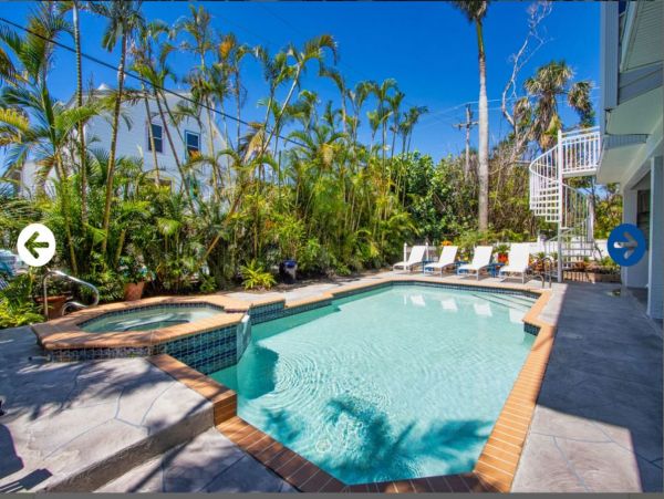 Beautifully Appointed Four Bedroom with Screened in Pool!