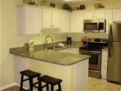 Well Stocked Kitchen with Breakfast Bar Well Stocked Kitchen with Breakfast Bar