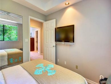 Wall Mounted TV in Queen Bedroom