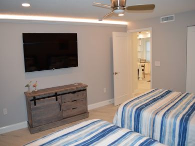 Flat sceen t.v. in bedroom with two beds