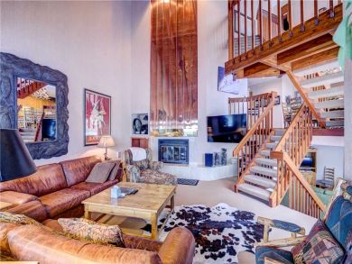 Spacious Living Area with Stairs to the First Floor
