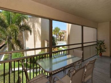 Screened Lanai with Table and Chairs