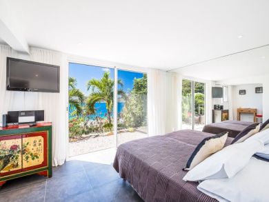 Bedroom with Wall Mounted TV
