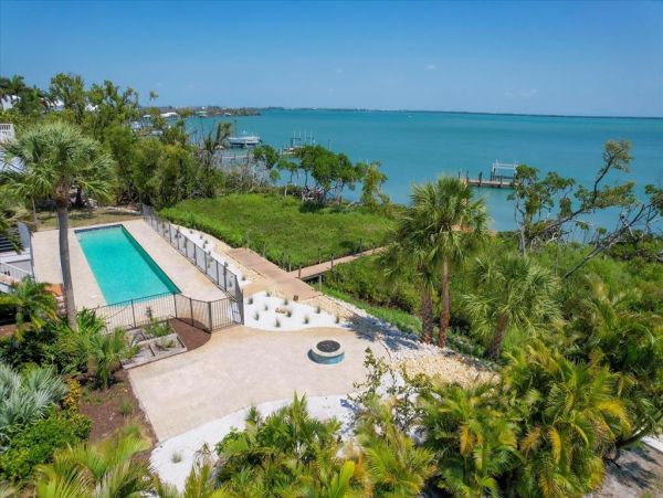 Boca Grande Luxury 4-Bedroom Bayfront Home with Dock and Short Walk to Sandy Beach Huge Pool!